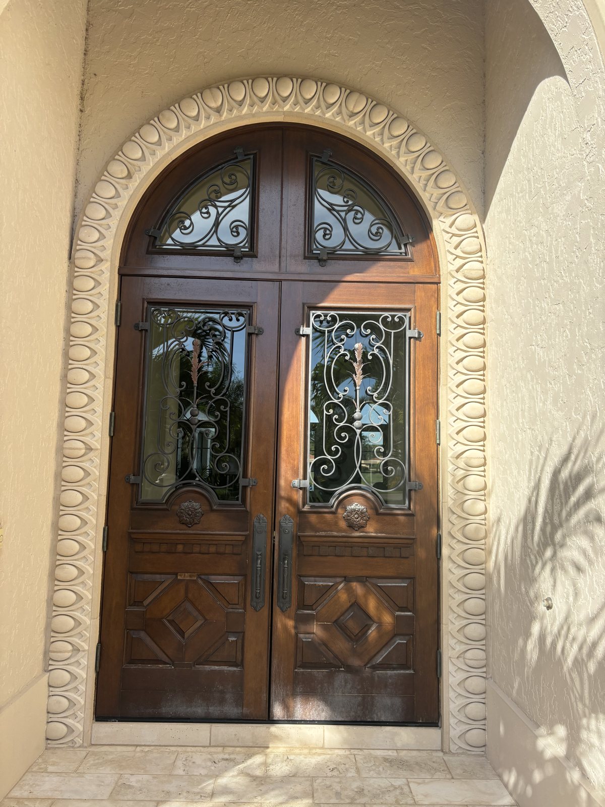 Front entry before its custom iron door was replaced, Florida